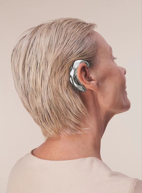 Image of person hearing hearing aid 